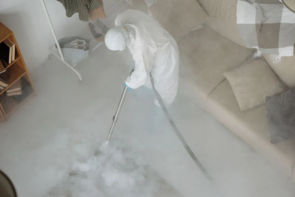 Biohazard cleanup technician in protective equipment, Howard Lake, MN